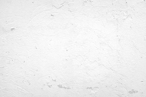 istock white concrete surface and white paint peeling from the wall, for use as a background. 1321076885