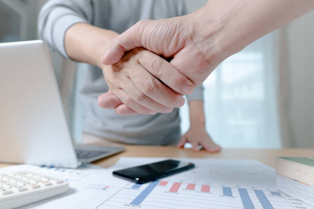 istock Businessman are shaking hands in office. Collaborative teamwork. 1321079864