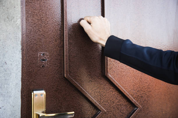 istock the man knocks on the door 1321081811