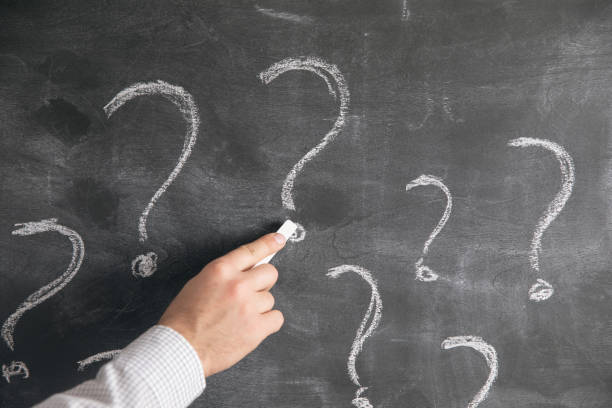 istock writes a question mark in chalk on a blackboard 1321081915
