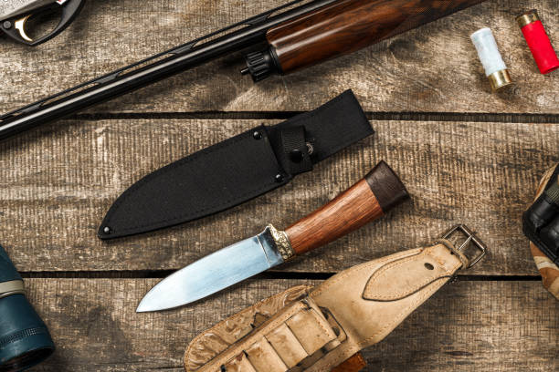 istock Various hunting equipment on old wooden background 1321083464