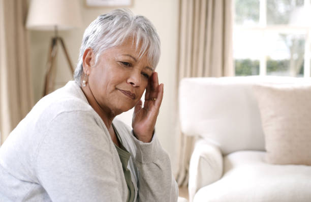 istock Shot of an elderly woman experiencing a headache 1321083517