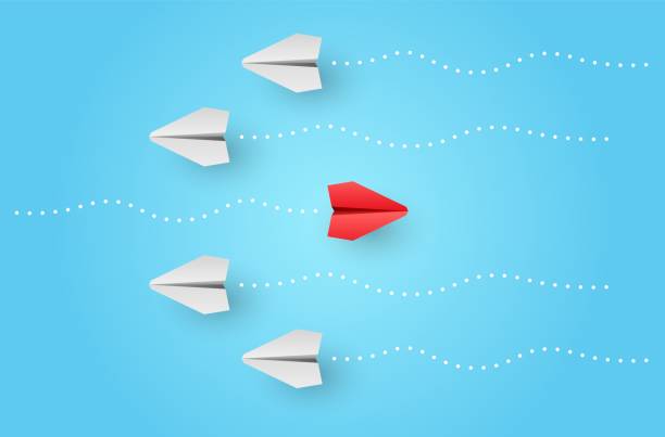istock Think different. Individuality concept. Individual and unique leader red paper plane flies to the side 1321085908