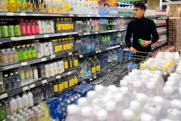 istock Male customer in grocery store shopping 1321087876