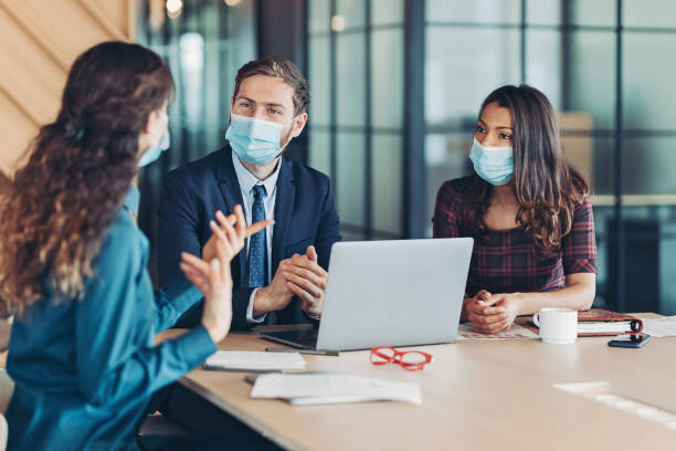 istock Business people working together during the pandemics 1321088047