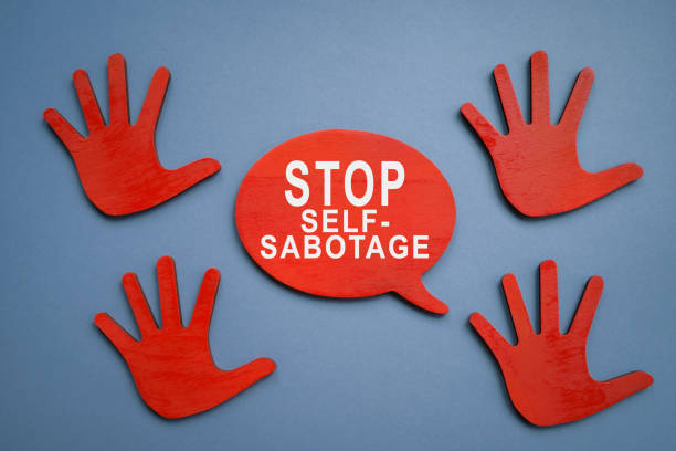 Stop self sabotage sign and wooden hands. Stop self sabotage sign and wooden hands. sabotage stock pictures, royalty-free photos & images