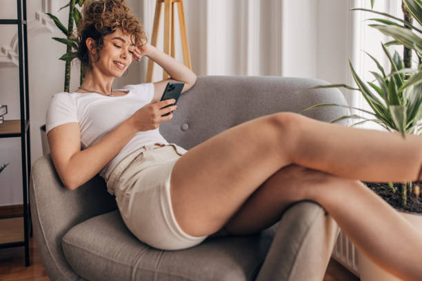 istock Beautiful woman using phone 1321090439
