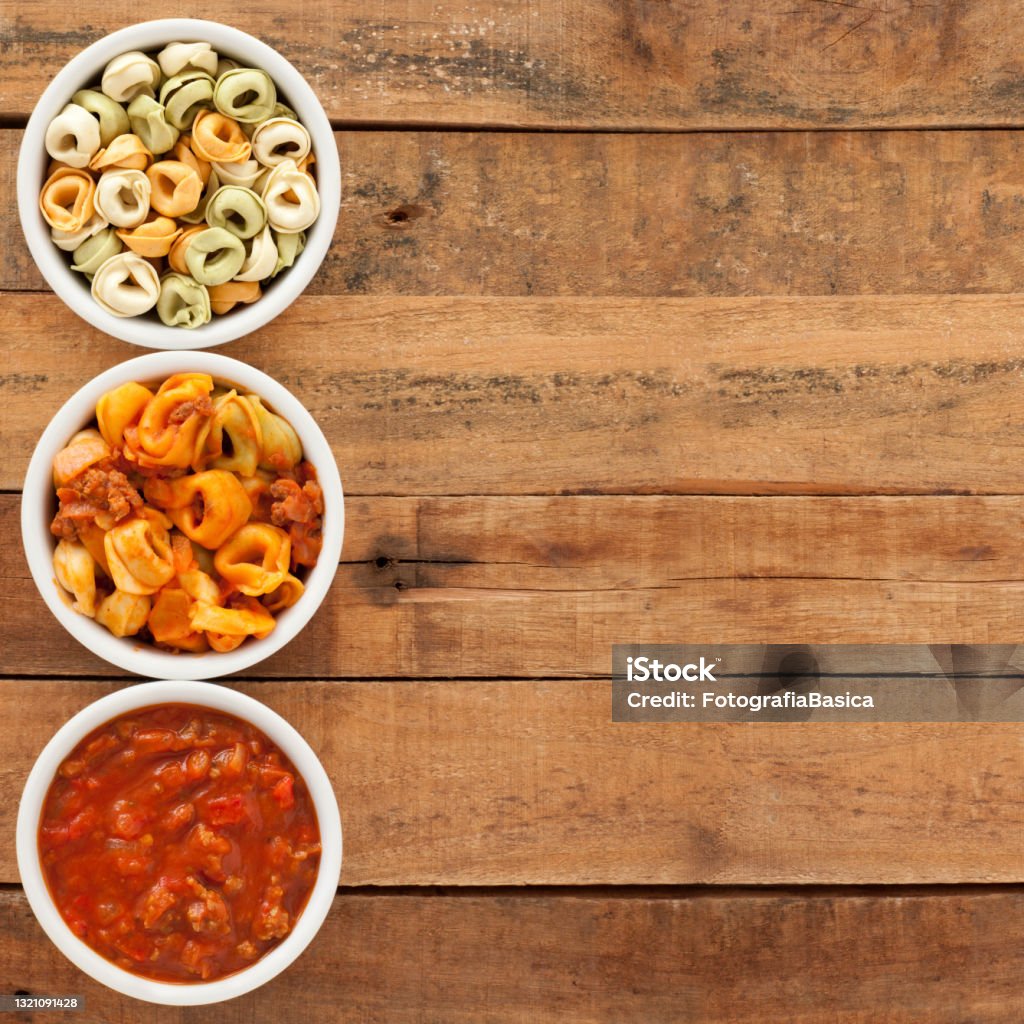 Bolognese tortellini - Wikipedia Top view of three bowls with tortellini bolognese and ingredients Beige Stock Photo