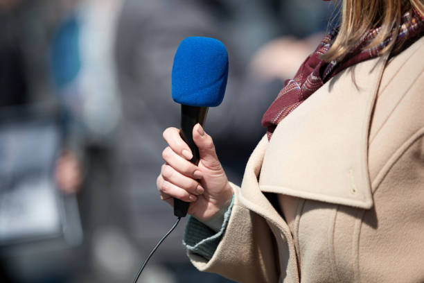 istock News broadcasting and recording protest on the streets. 1321091870