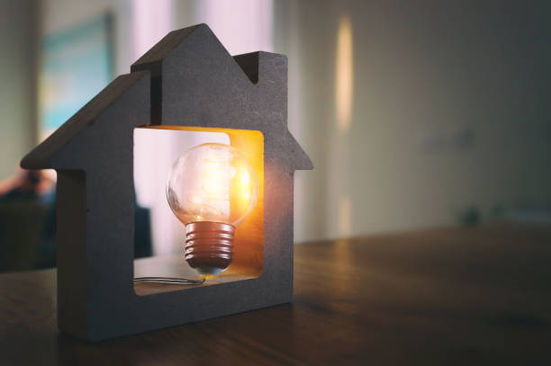 istock Wood house with Light bulb. energy concept or invention 1321094448