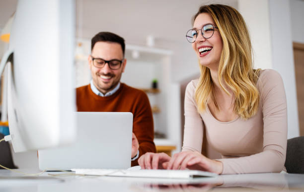 istock Business people having fun and chatting at workplace office 1321095909