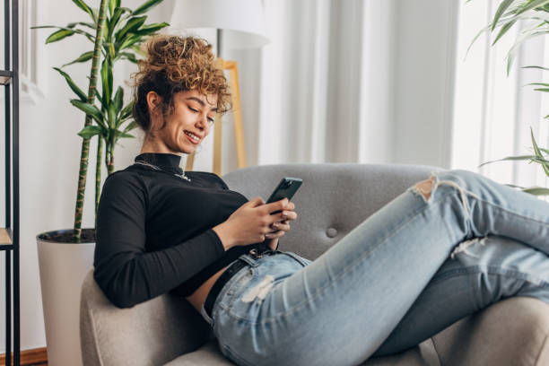 istock Beautiful woman using phone 1321097495