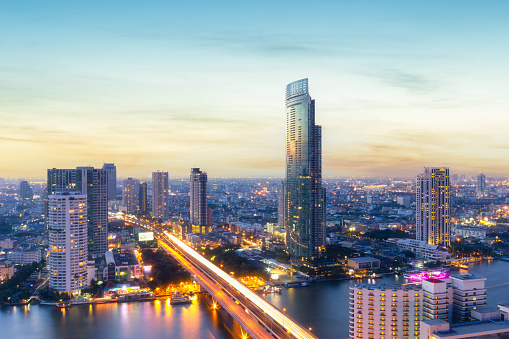 Aerial view modern office buildings in Bangkok city downtown with sunset time, Bangkok, Thailand