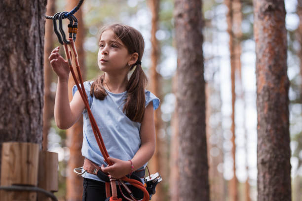 istock Girl adjusting static rope at adrenalin park 1321101705