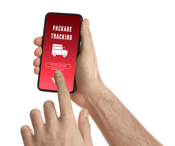 istock Man tracking parcel via smartphone on white background, closeup 1321101829