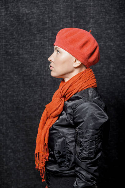 istock Woman wearing red beret and scarf 1321107084