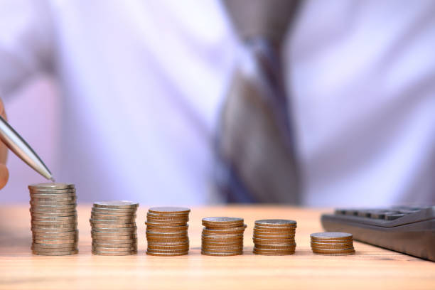 istock Saving money concept and stacks of coins on the table 1321107103
