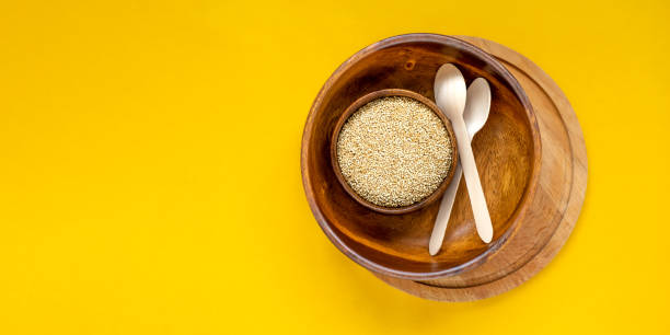 istock Eco friendly tableware. Wood bowl, dishes, spoon on yellow background. Recycling concept. Top view. 1321108912