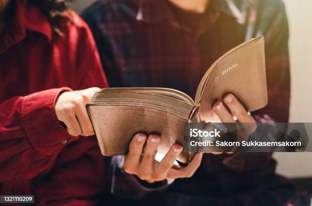 A Woman And Two Men Were Studying And Reading The Bible That Is Christian Love Stock Photo - Download Image Now