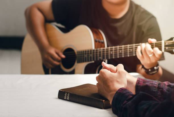 istock Young Christian Praying With Words And Singing Praises To God Reading Scriptures And Sharing Gospel With Copy Space 1321110215