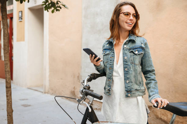 istock Amazing happy beautiful woman using mobile phone 1321111574