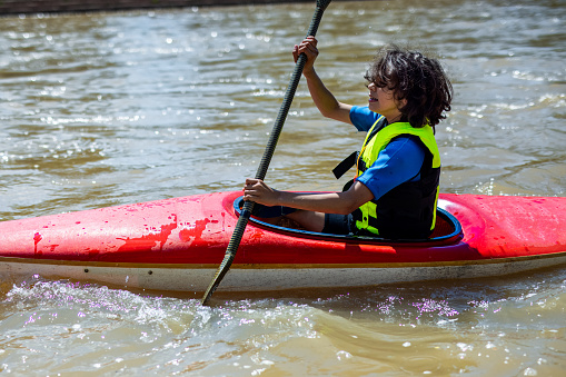 Boy kayaking in the river