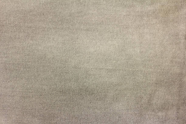istock Grey denim background.Grey denim as a close-up background.Selective focus. 1321118731