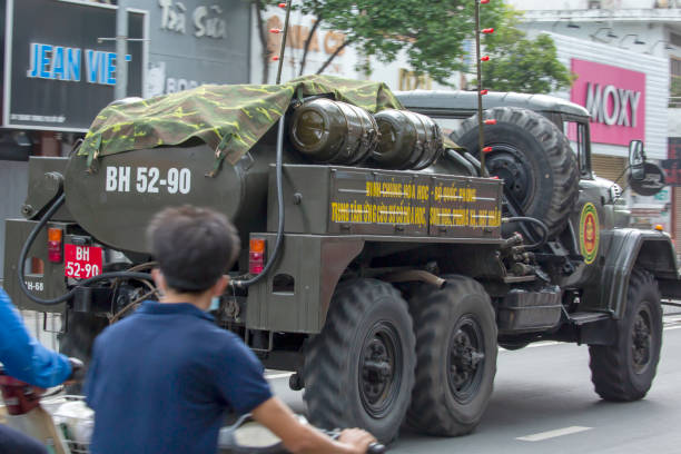 Today many military trucks of Military Zone 7 have sprayed disinfectant along many highly traffic streets in Go Vap district, Ho Chi Minh city tp prevent Covid-19 spread. Within these 2 weeks over one hundred of cases founded positive in the community.Seen here is one military truck in action at Quang Trung street