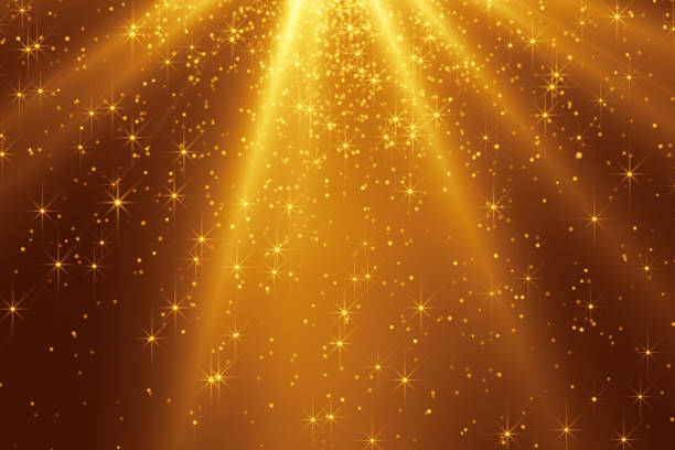 istock Warm glowing falling golden stars and light 1321119140