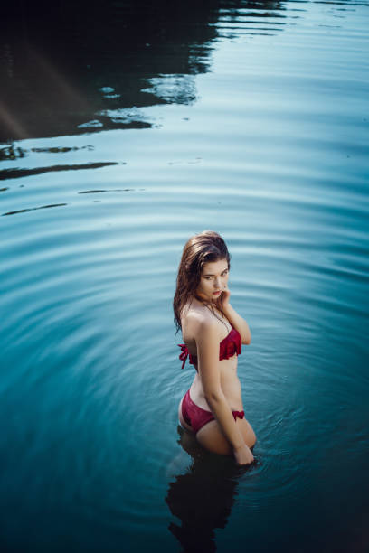 istock Beautiful young girl resting in water 1321119259