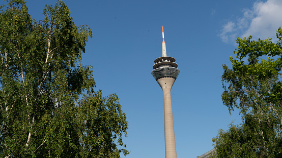 Rheinturm Tower in Düsseldorf Germany with cloudy skies