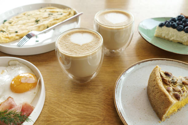 istock Bright breakfast, eggs, cups of coffee, desserts. 1321122608