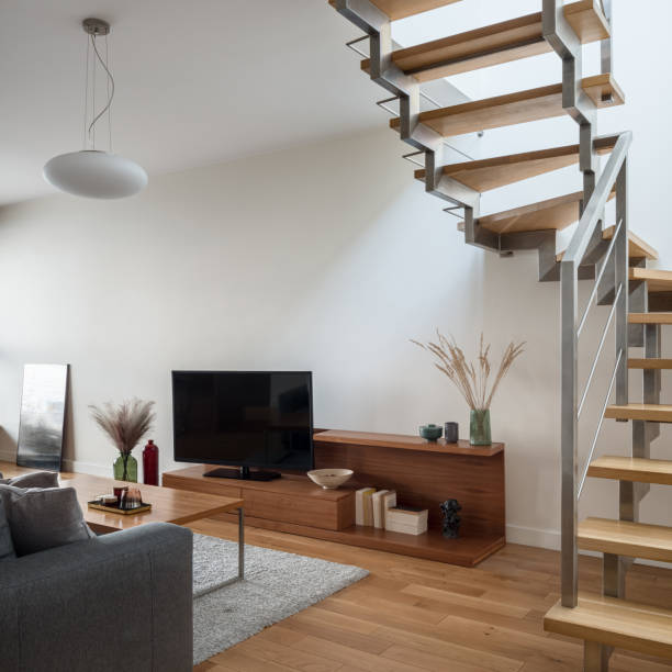 istock Tv screen in living room with stairs 1321123274