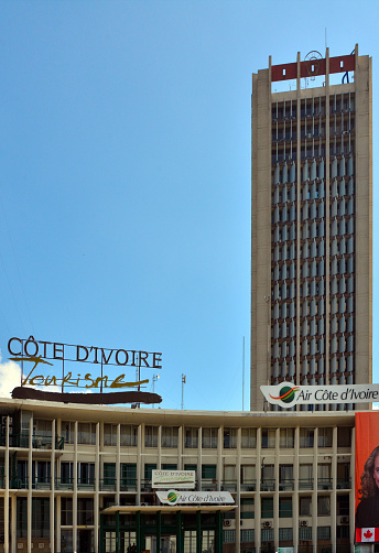 Abidjan, Ivory Coast / Côte d'Ivoire: Offices of Air Côte d'Ivoire, the flag carrier of Ivory Coast, and the Ivory Coast tourism - Place de la République, EECI tower in the background (power company).