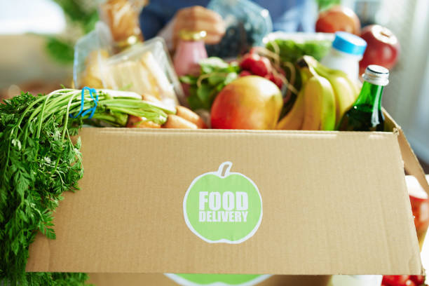 istock Closeup on woman with food box in kitchen 1321126705