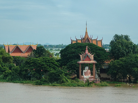 Rural Kampong Provence, Cambodia- September, 4, 2018: Riverside Buddhist shrine and temple in rural Cambodia.