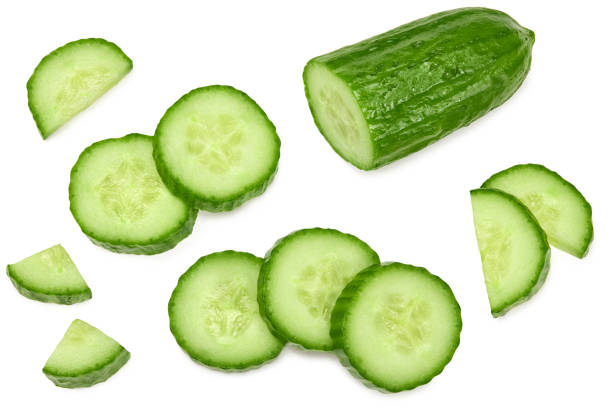 istock cucumber with slices isolated on white background. clipping path. top view 1321129491