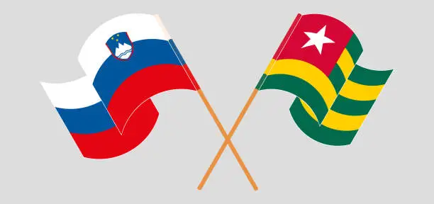 Vector illustration of Crossed and waving flags of Slovenia and Togo