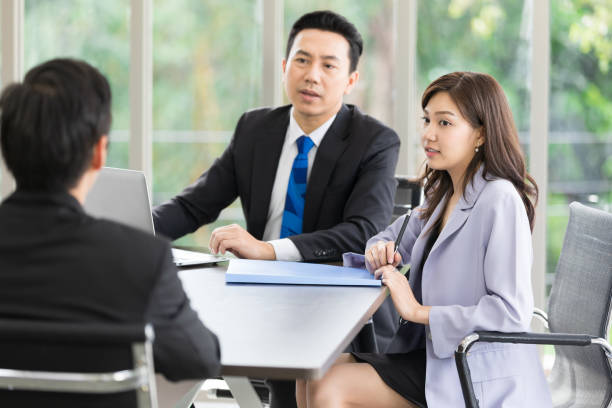 istock asian business team listening to co-worker explaining about work or project 1321133866