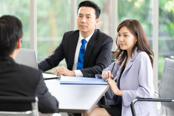 istock asian business team listening to co-worker explaining about work or project 1321133870