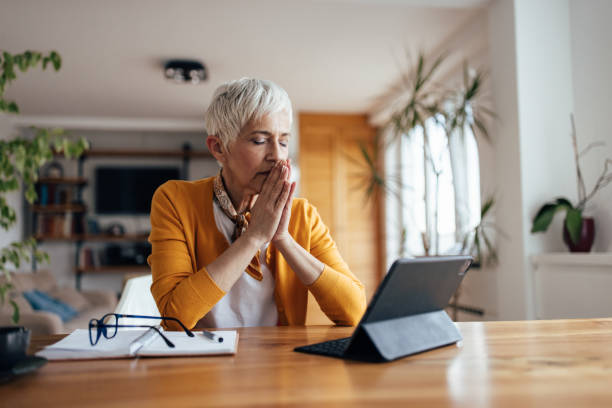 istock Senior woman, calming herself down. 1321138453
