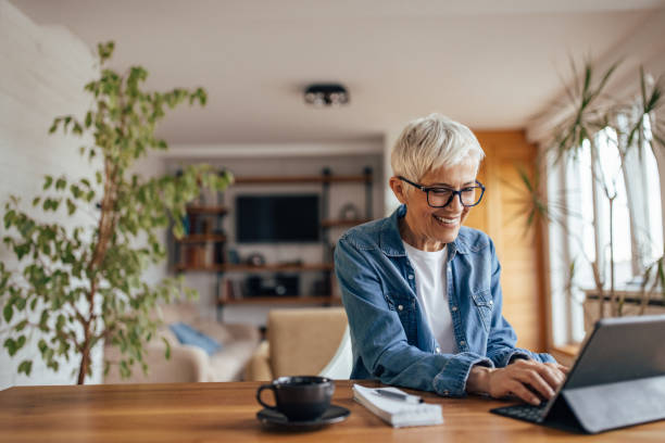 istock Senior woman, doing her taxes on time. 1321138694