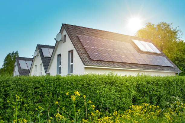 solar panels on the roof of the modern family houses - solar roof imagens e fotografias de stock