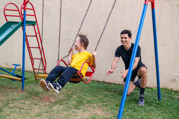istock Father and son at the playground. 1321146861