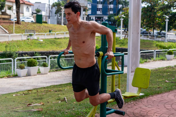istock Man exercising in a public park. 1321147037