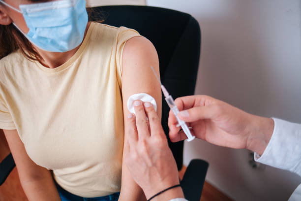 istock Young women receiving coronavirus vaccine 1321153620