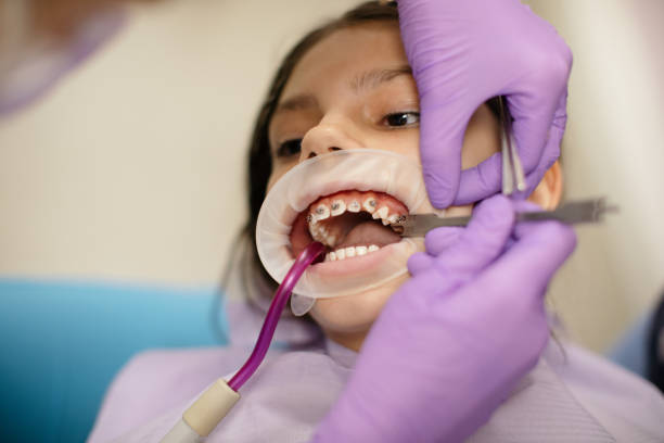 istock Girl at dentist office 1321154678
