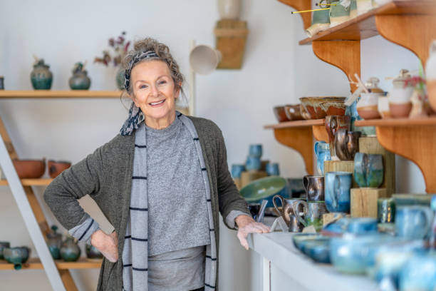 istock Happy pottery shop owner 1321155045