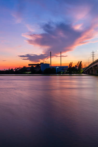 istock bridge over river in the evening. The light from the lamp to the reflector surface,Container Terminal in Hamburg, Germany. Bridge is called Koehlbrandbruecke - a bridge about the harbor. 1321155242
