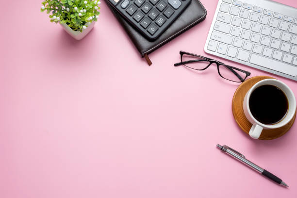 istock Workspace with equipment working concept on pink background copy space. 1321158090